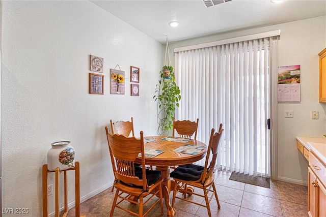 8853 Kingswood Dr, Las Vegas, NV 89147 - dining space featuring baseboards and light tile patterned flooring