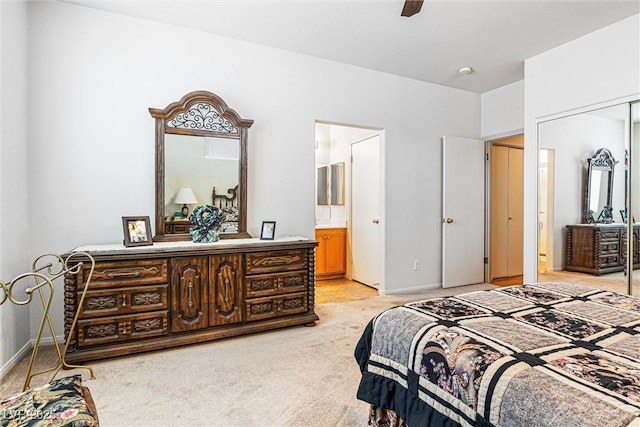 8853 Kingswood Dr, Las Vegas, NV 89147 - bedroom with light carpet, ensuite bathroom, ceiling fan, and a closet