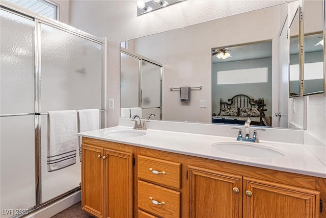 8853 Kingswood Dr, Las Vegas, NV 89147 - ensuite bathroom with a stall shower, double vanity, and a ceiling fan