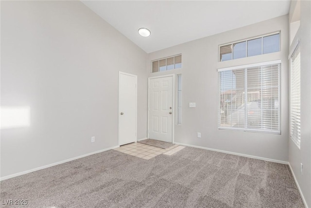 5402 Shady Lair Ct, North Las Vegas, NV 89031 - carpeted foyer featuring high vaulted ceiling and baseboards