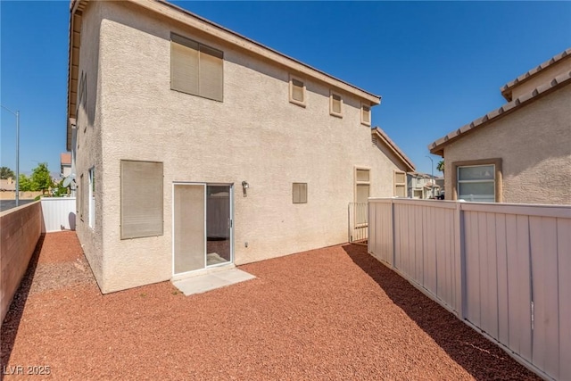 5402 Shady Lair Ct, North Las Vegas, NV 89031 - back of house featuring stucco siding and a fenced backyard
