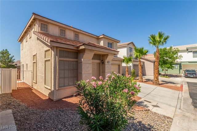 5402 Shady Lair Ct, North Las Vegas, NV 89031 - view of front of house featuring stucco siding, a garage, and driveway