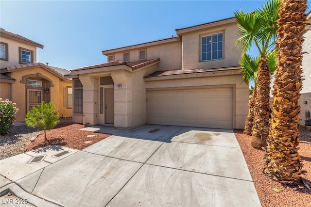 5402 Shady Lair Ct, North Las Vegas, NV 89031 - view of front of home with concrete driveway, stucco siding, a tile roof, and a garage