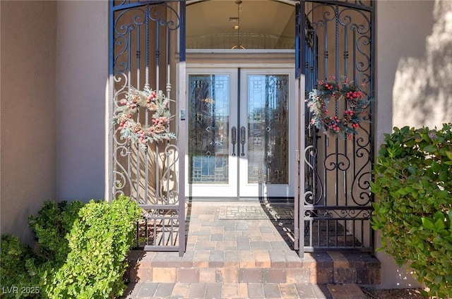 5193 N Miller Ln, Las Vegas, NV 89149 - doorway to property featuring french doors, stucco siding, and a gate