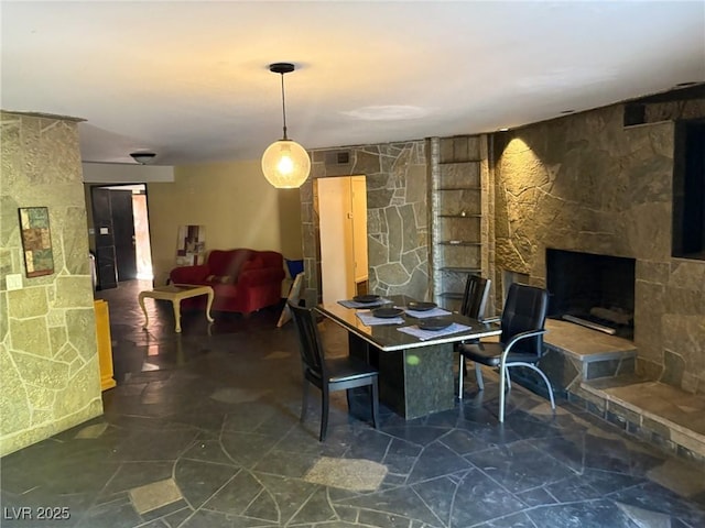3167 El Cedro Cir, Las Vegas, NV 89121 - dining area with a stone fireplace