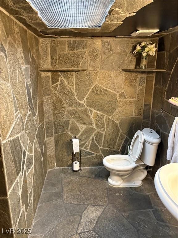 3167 El Cedro Cir, Las Vegas, NV 89121 - bathroom with stone tile flooring and toilet