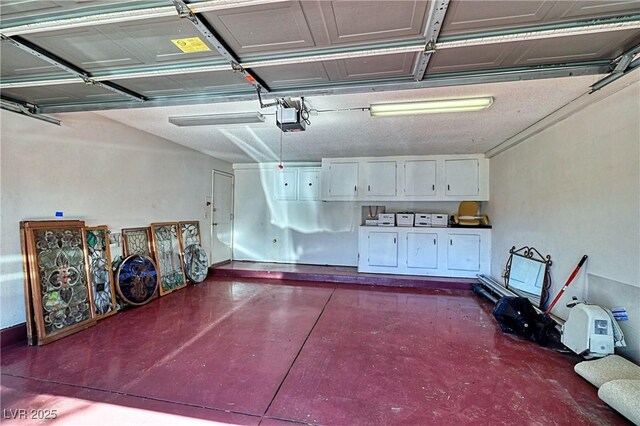 940 Vegas Valley Dr, Las Vegas, NV 89109 - garage featuring a garage door opener and independent washer and dryer