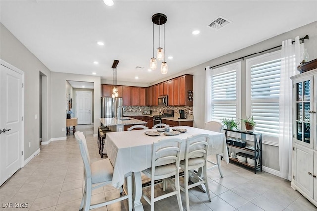 2383 Elmont Ave, North Las Vegas, NV 89086 - dining room with light tile patterned floors and recessed lighting