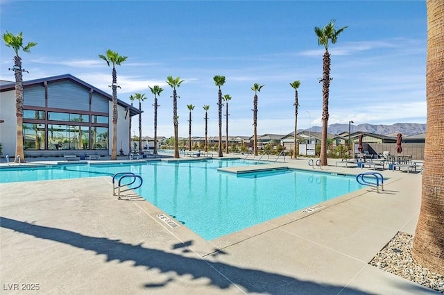 2383 Elmont Ave, North Las Vegas, NV 89086 - community pool featuring a patio area and a mountain view