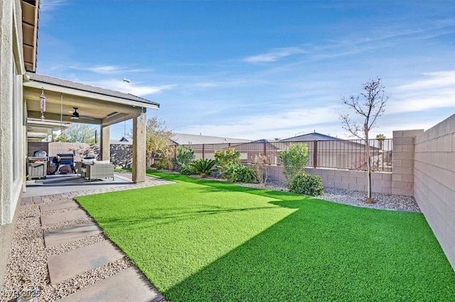 2383 Elmont Ave, North Las Vegas, NV 89086 - fenced backyard featuring a patio and ceiling fan