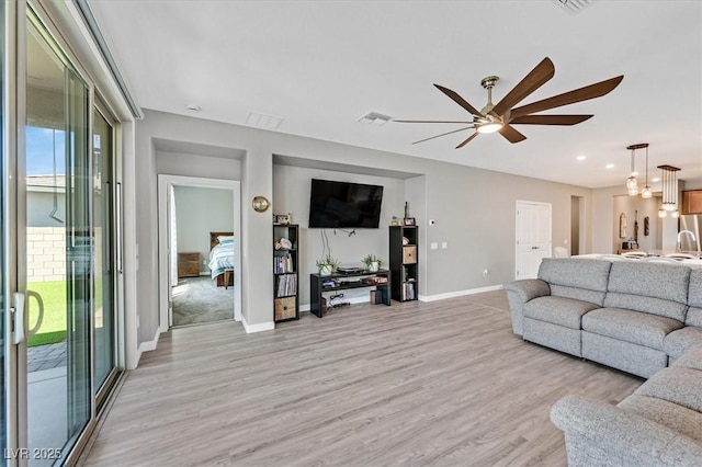 2383 Elmont Ave, North Las Vegas, NV 89086 - living room featuring ceiling fan, light wood-style floors, and recessed lighting
