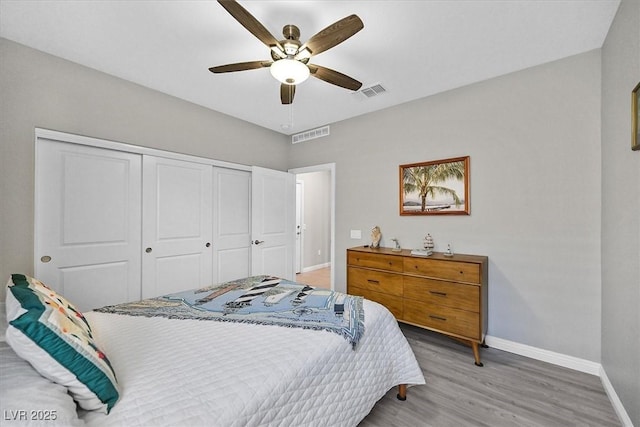 2383 Elmont Ave, North Las Vegas, NV 89086 - bedroom featuring a closet, light wood-style floors, and a ceiling fan
