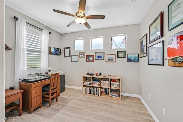 2383 Elmont Ave, North Las Vegas, NV 89086 - home office featuring a ceiling fan, healthy amount of natural light, and light wood-style floors