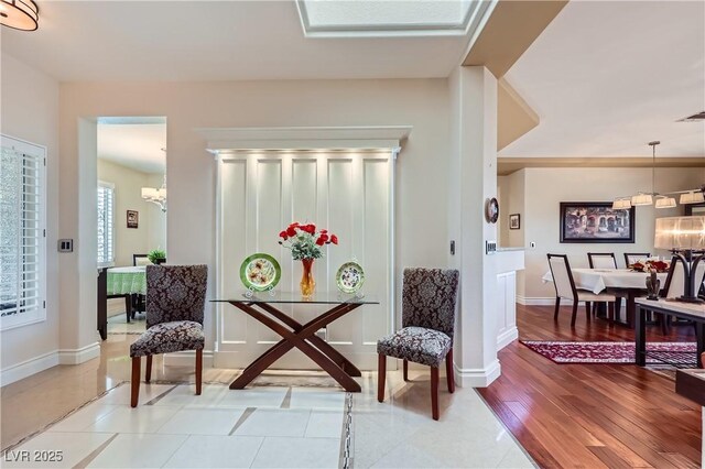 1897 Holdenville St, Henderson, NV 89052 - sitting room featuring a chandelier and light wood-type flooring