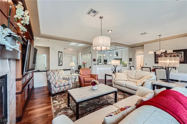 1897 Holdenville St, Henderson, NV 89052 - living room with dark wood-type flooring and a glass covered fireplace