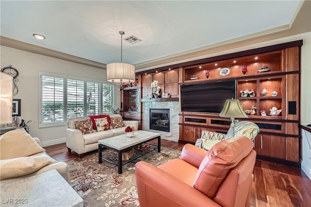 1897 Holdenville St, Henderson, NV 89052 - living room with dark wood-style flooring, a high end fireplace, and recessed lighting