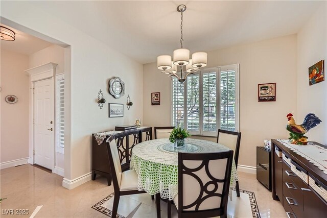 1897 Holdenville St, Henderson, NV 89052 - dining area with a chandelier and light tile patterned flooring