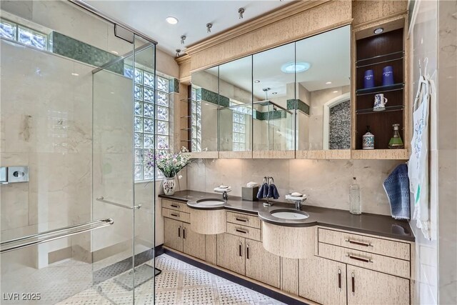 1897 Holdenville St, Henderson, NV 89052 - bathroom with vanity, a shower stall, and inlaid floor details