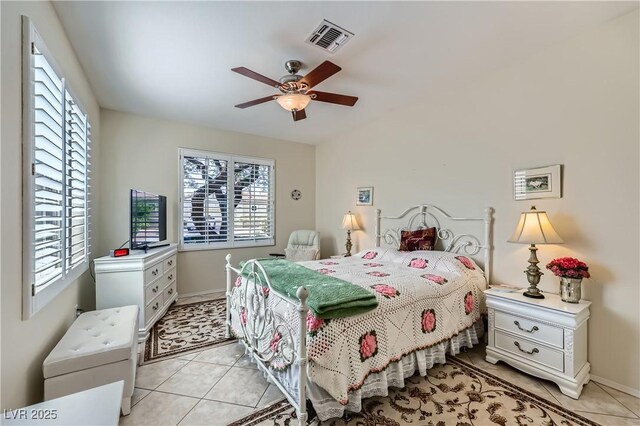 1897 Holdenville St, Henderson, NV 89052 - bedroom with multiple windows, light tile patterned flooring, and ceiling fan
