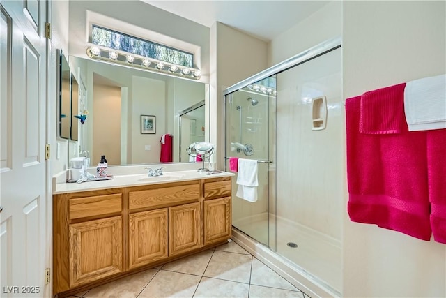 1897 Holdenville St, Henderson, NV 89052 - bathroom featuring tile patterned flooring, vanity, and a stall shower
