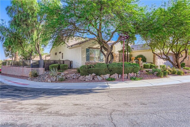 1897 Holdenville St, Henderson, NV 89052 - view of front of property with stucco siding