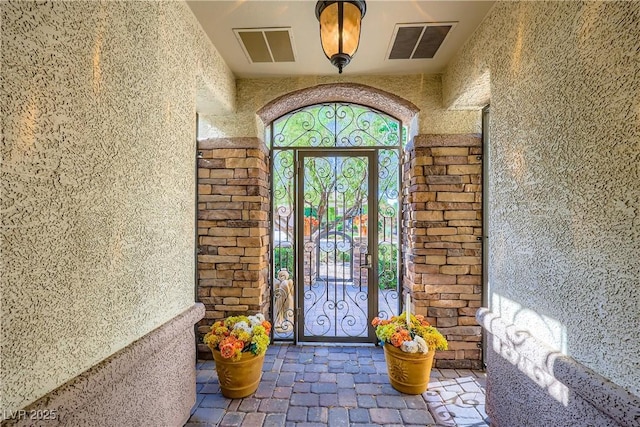 1897 Holdenville St, Henderson, NV 89052 - entrance to property with stucco siding and a gate