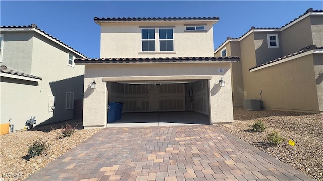 2713 Abrantes Pl, Henderson, NV 89044 - mediterranean / spanish-style home featuring stucco siding, decorative driveway, a garage, and a tiled roof