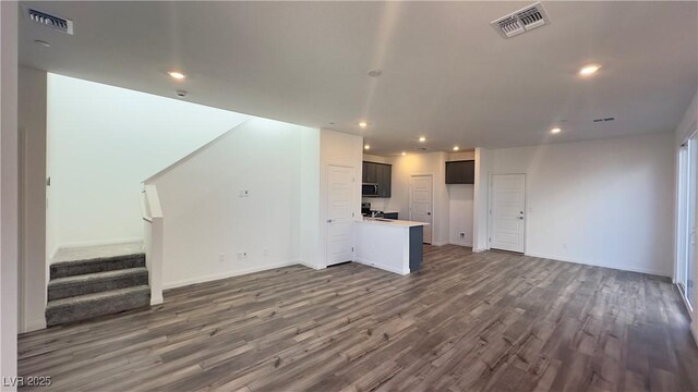 2713 Abrantes Pl, Henderson, NV 89044 - unfurnished living room featuring wood finished floors, recessed lighting, and stairway