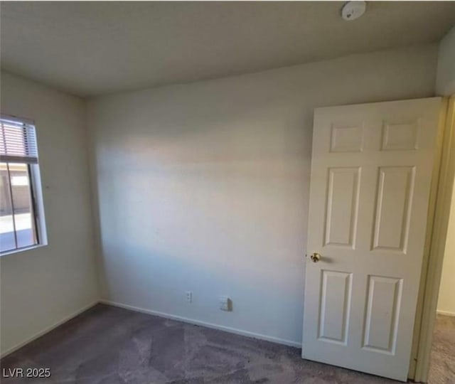 4300 N Lamont St Unit 232, Las Vegas, NV 89115 - unfurnished room with dark carpet and a smoke detector
