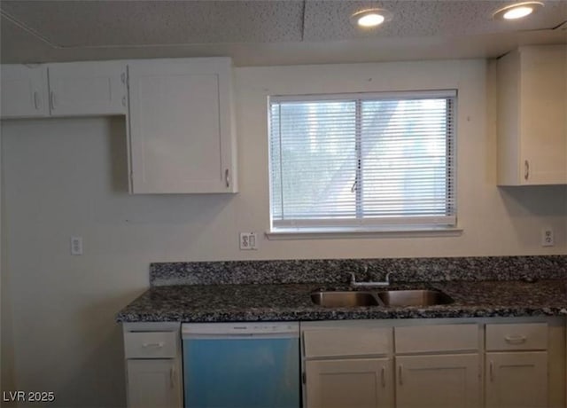 4451 Rich Dr Unit D, Las Vegas, NV 89102 - kitchen featuring dishwashing machine, white cabinets, dark stone counters, recessed lighting, and a textured ceiling