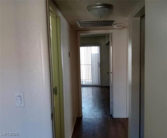 4451 Rich Dr Unit D, Las Vegas, NV 89102 - hallway with baseboards and a textured wall