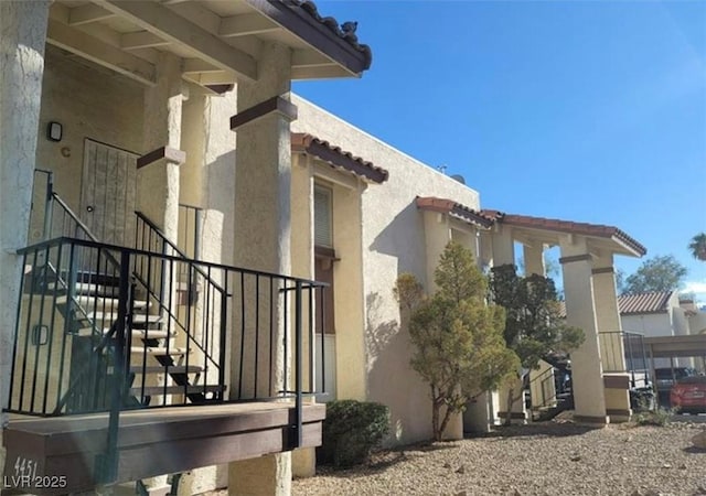 4451 Rich Dr Unit D, Las Vegas, NV 89102 - view of side of property featuring stucco siding and stairs