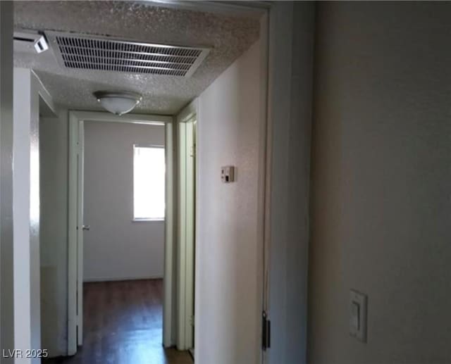 4451 Rich Dr Unit D, Las Vegas, NV 89102 - hall featuring wood finished floors and a textured ceiling