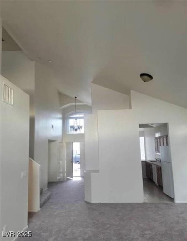 3237 Perching Bird Ln, North Las Vegas, NV 89084 - spare room with high vaulted ceiling and carpet