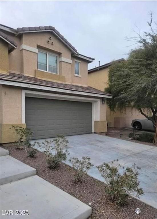 3237 Perching Bird Ln, North Las Vegas, NV 89084 - view of home's exterior featuring an attached garage, stucco siding, and concrete driveway