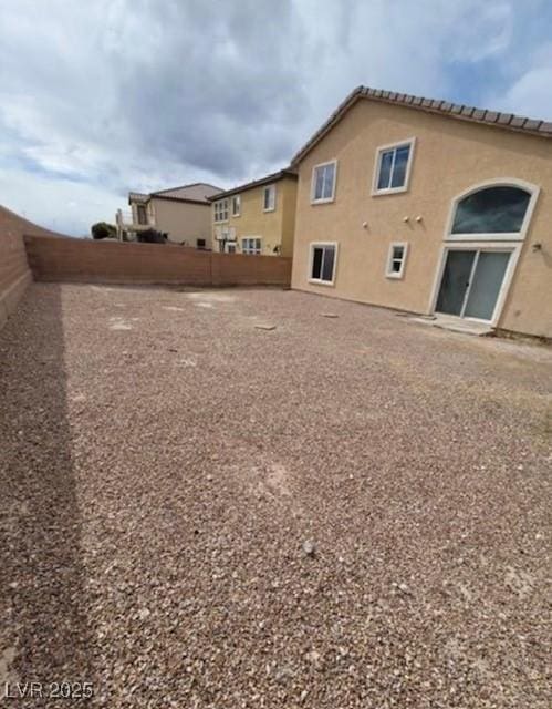 3237 Perching Bird Ln, North Las Vegas, NV 89084 - back of house featuring a fenced backyard and stucco siding