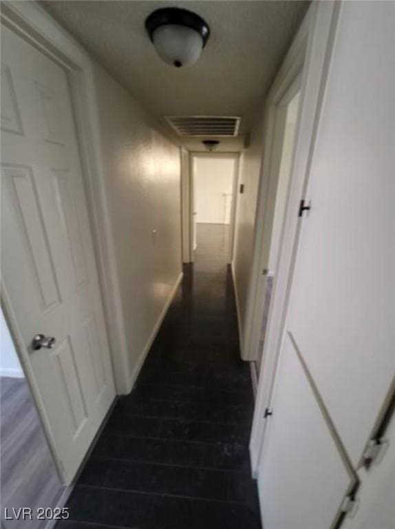 3755 Chutney St, Las Vegas, NV 89121 - corridor with dark wood finished floors and baseboards