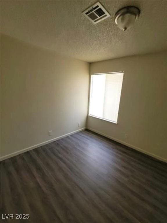 3755 Chutney St, Las Vegas, NV 89121 - spare room with dark wood finished floors and a textured ceiling