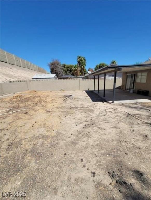3755 Chutney St, Las Vegas, NV 89121 - fenced backyard featuring a patio area
