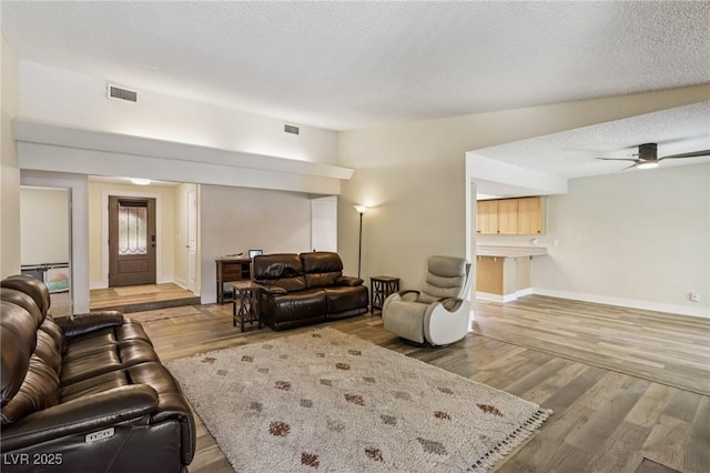 667 Del Prado Dr, Boulder City, NV 89005 - living area with wood finished floors, ceiling fan, and a textured ceiling
