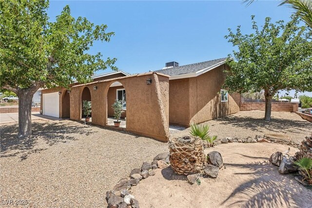 667 Del Prado Dr, Boulder City, NV 89005 - view of front of home with driveway and stucco siding