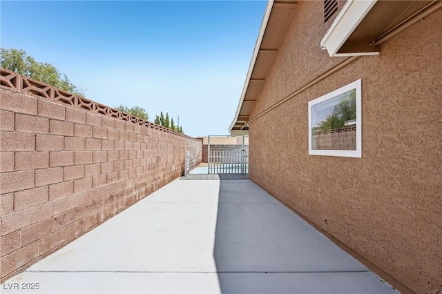 667 Del Prado Dr, Boulder City, NV 89005 - view of side of property with stucco siding and a patio area
