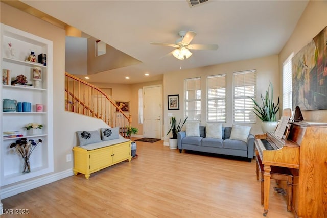 98 Milicity Rd, Henderson, NV 89012 - living area featuring light wood-style flooring, stairway, a ceiling fan, built in features, and recessed lighting