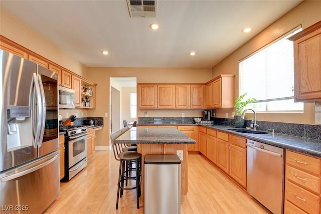 98 Milicity Rd, Henderson, NV 89012 - kitchen featuring appliances with stainless steel finishes, light wood-style floors, healthy amount of natural light, and recessed lighting