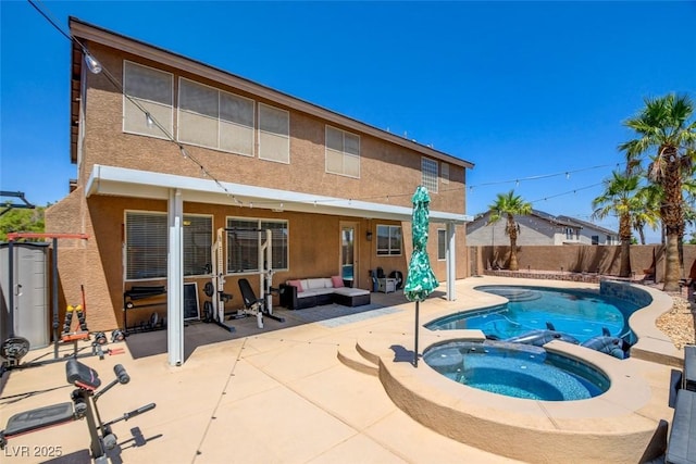 98 Milicity Rd, Henderson, NV 89012 - rear view of property featuring stucco siding, a patio, outdoor lounge area, and a fenced backyard