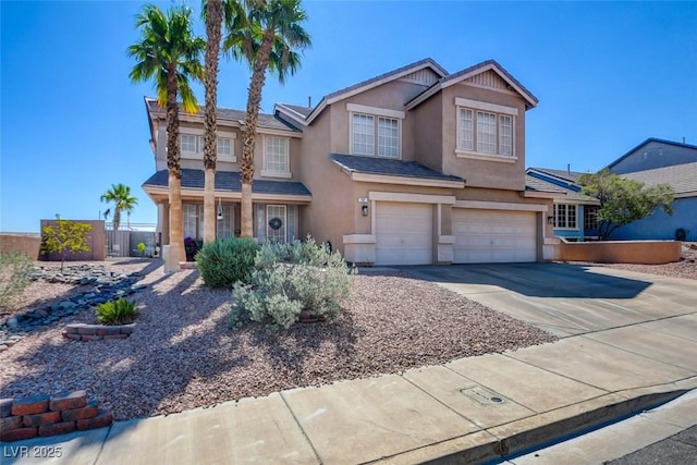 98 Milicity Rd, Henderson, NV 89012 - view of front of property featuring an attached garage, stucco siding, and concrete driveway