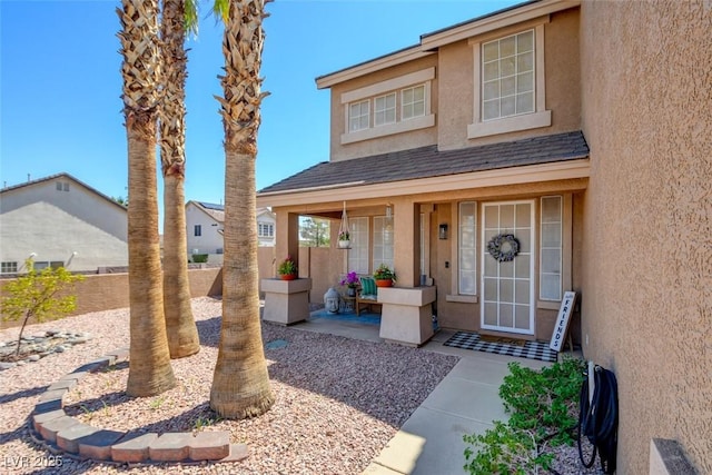 98 Milicity Rd, Henderson, NV 89012 - view of front of house featuring stucco siding and a porch