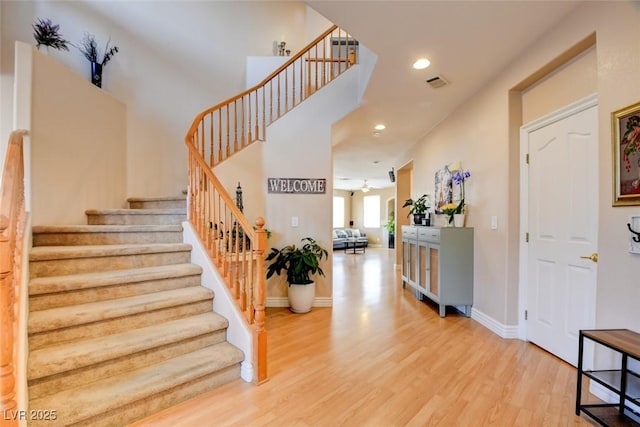 98 Milicity Rd, Henderson, NV 89012 - foyer entrance featuring wood finished floors, stairs, and recessed lighting