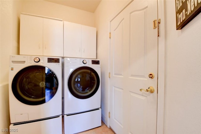 98 Milicity Rd, Henderson, NV 89012 - laundry area with washer and dryer, cabinet space, and light tile patterned floors