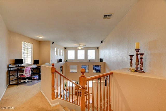 98 Milicity Rd, Henderson, NV 89012 - corridor with an upstairs landing, plenty of natural light, a desk, and carpet